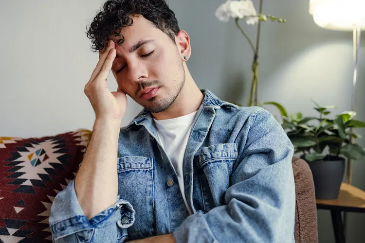photo of young man with a headache