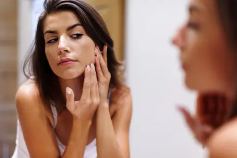 photo of woman checking facial complexion