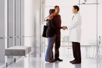 photo of couple meeting doctor
