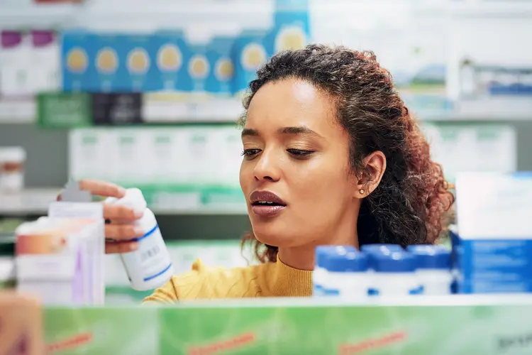 photo of woman shopping for pain reliever