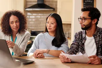 photo of financial advisor talking with couple