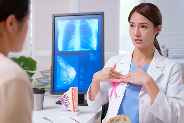 photo of doctor explaining breast cancer test results to patient