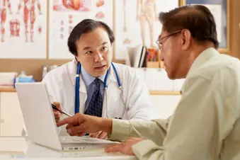 photo of doctor listenting to patient