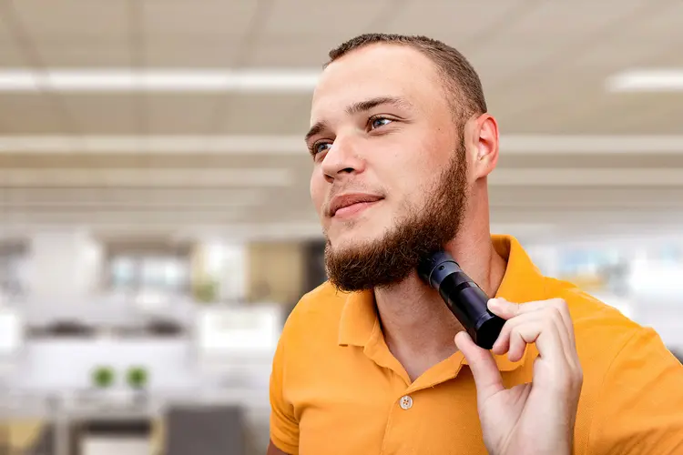 photo of man using electrolarynx
