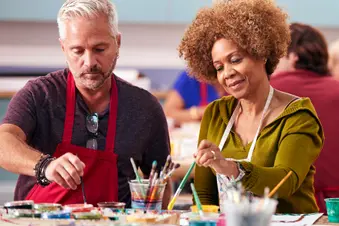 photo of group of mature adults in art class