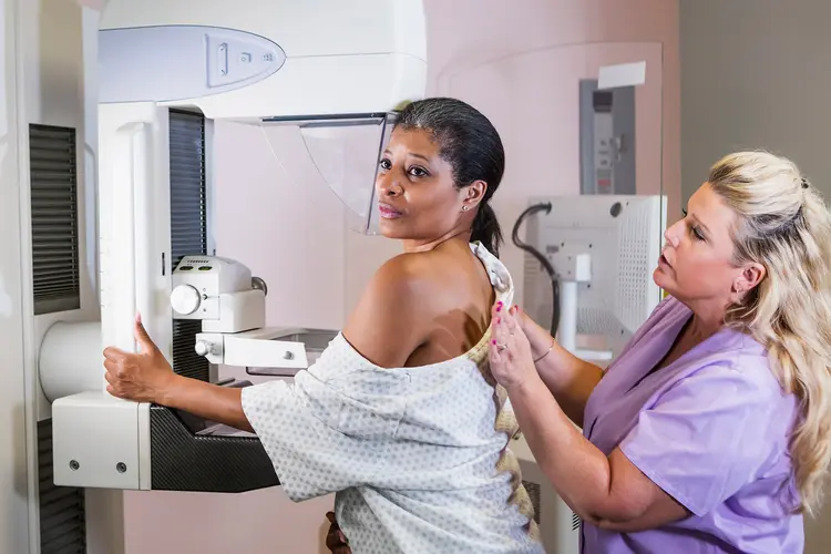photo of mature woman getting mammogram