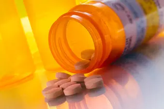 photo of prescription pills spilling from bottle