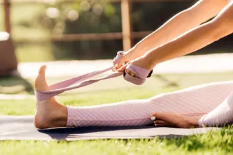 photo of woman doing stretching exercise outdoors