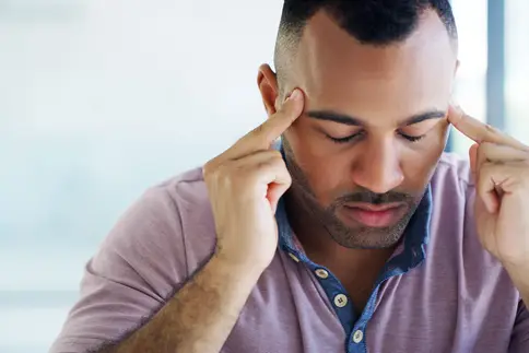 photo of man with temple headache