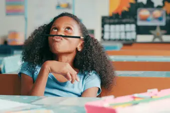 photo of young girl looking bored in class