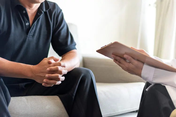 photo of doctor asking patient questions