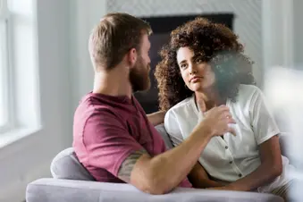 photo of couple having serious talk