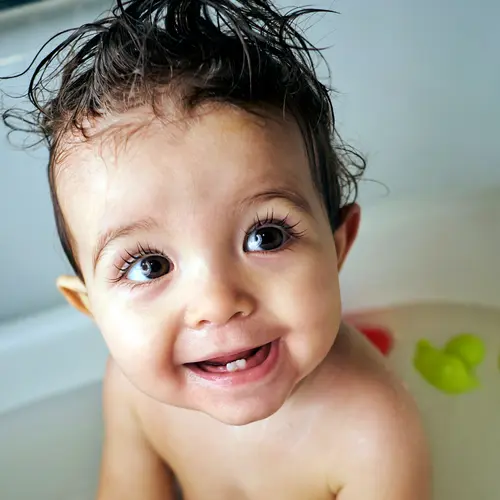 photo of happy baby in bathtub