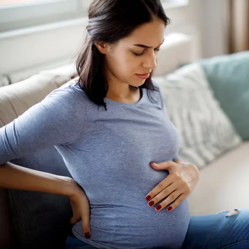 photo of pregnant woman with backache