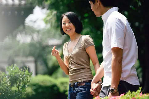 photo of couple walking outdoors