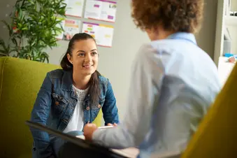 photo of young woman in talk therapy session