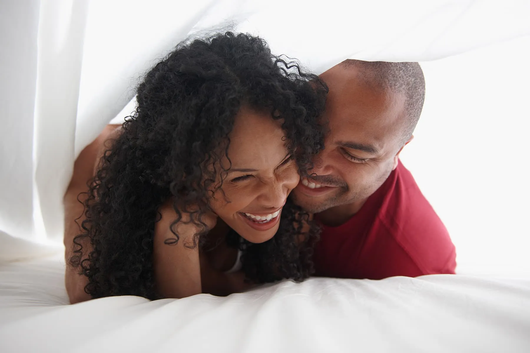 photo of a couple in bed
