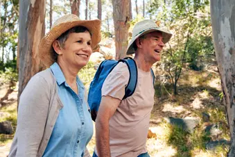 photo of mature couple walking for exercise