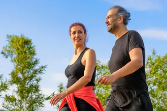 photo of mature couple walking for exercise