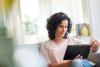 photo of woman reading at home