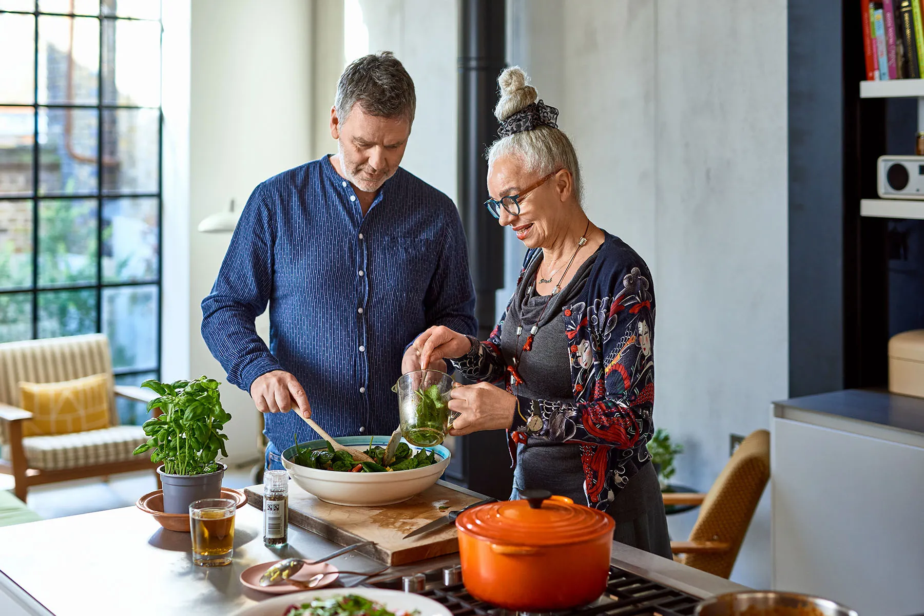 photo of couple preparing dinner at home