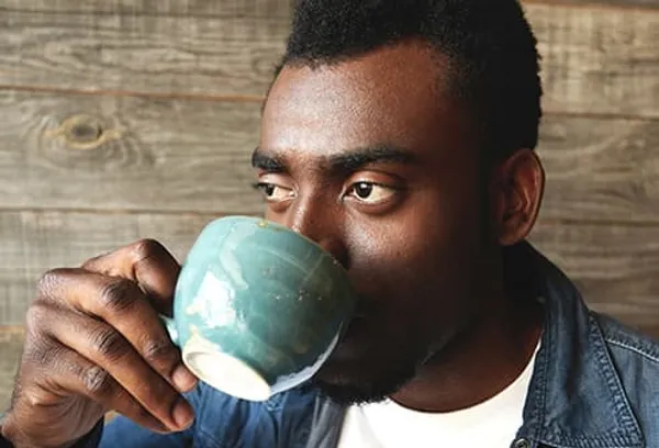 young man drinking coffee