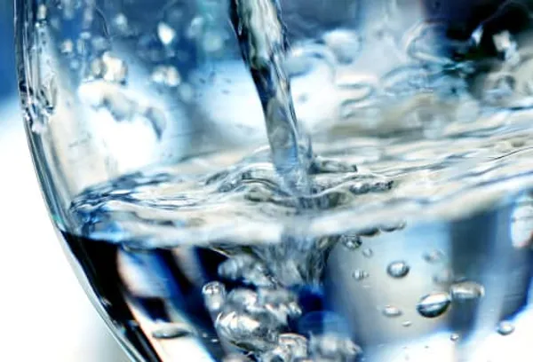 pouring water in a glass