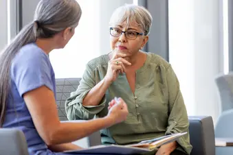 photo of senior woman listening to doctor