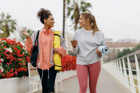 photo of friends walking to exercise class