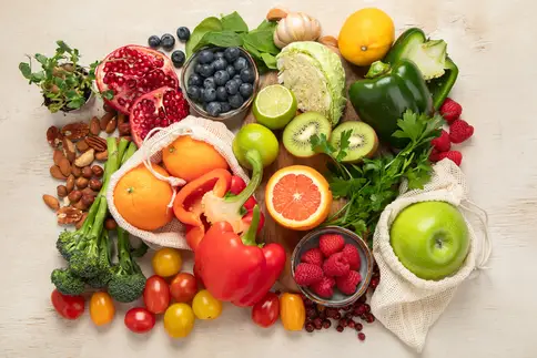 photo of various food items including vegetables, fruits and nuts for a vitamin rich diet