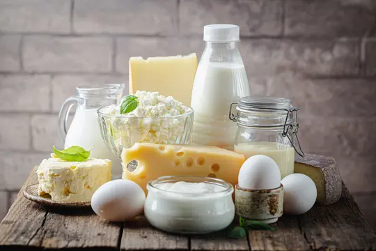 photo of foods with calcium and folic acid such as cheese, milk, and eggs