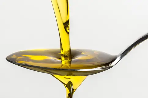 photo of pouring olive oil