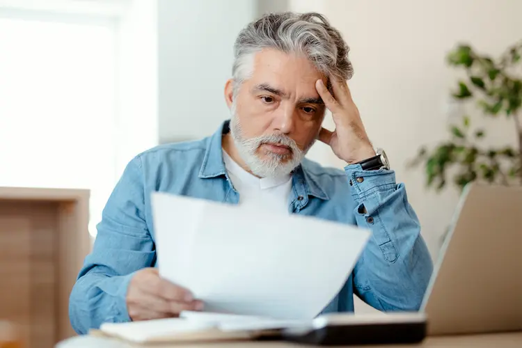 photo of man stressed about medical bills