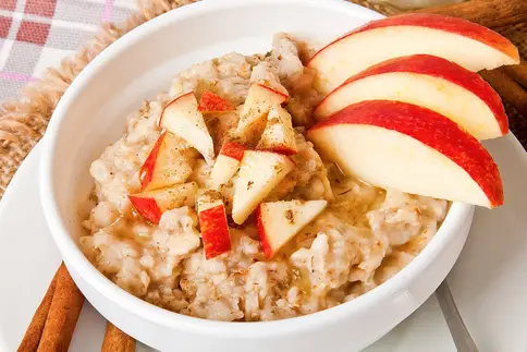 photo of oatmeal with sliced apples