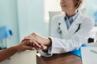 photo of doctor comforting patient