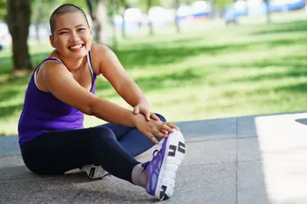 photo of woman stretching outdoors