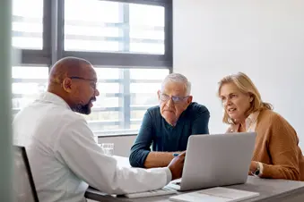 photo of doctor discussing diagnosis with couple