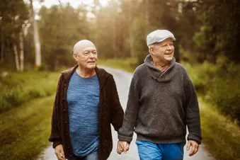photo of older gay couple walking outside