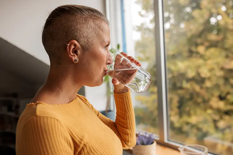 photo of female cancer patient drinking water