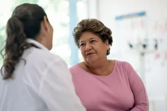 photo of patient talking with doctor