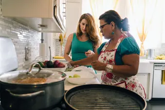 photo of Hispanic mom and daughter cooking