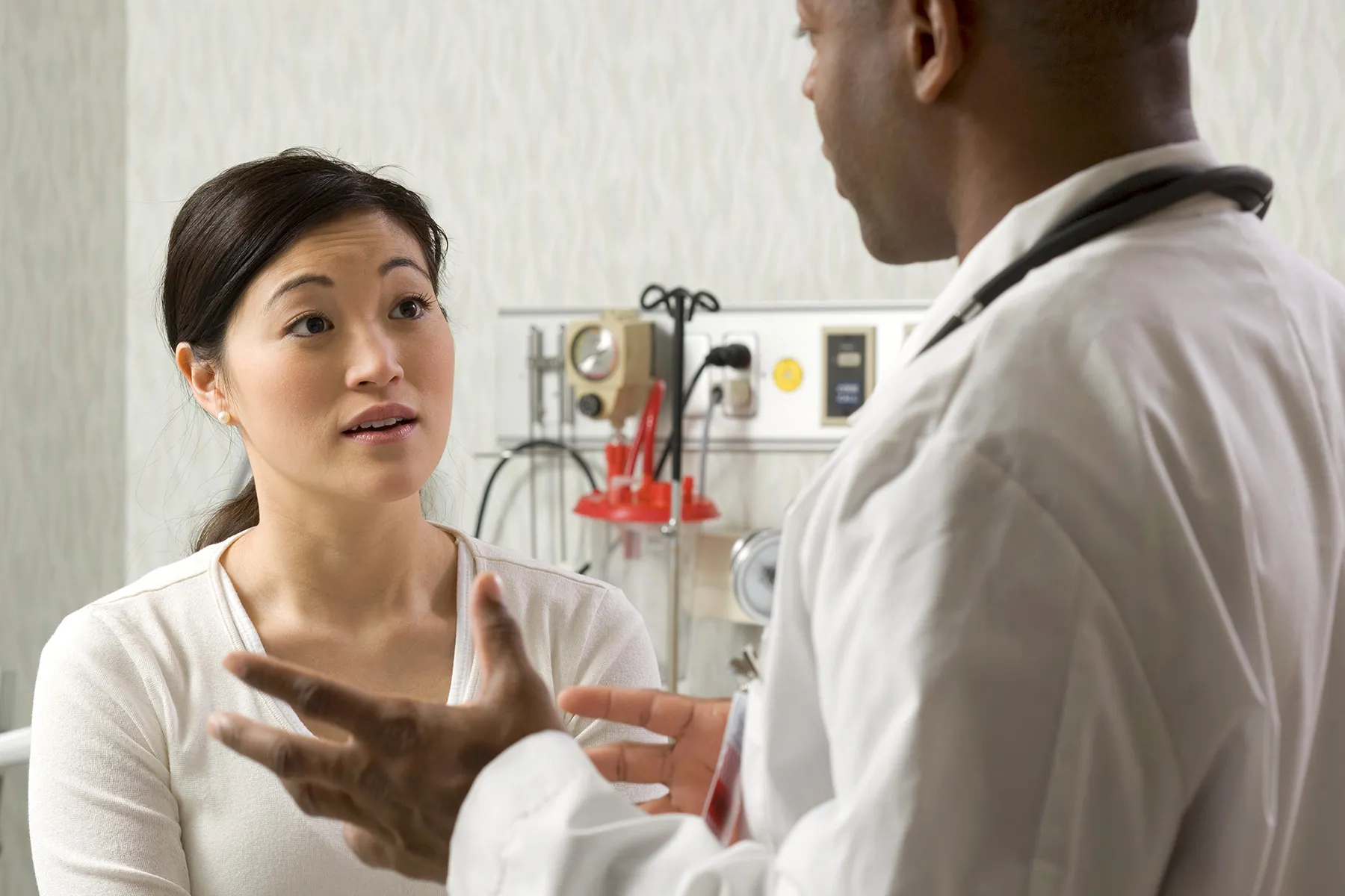 photo of patient talking with doctor