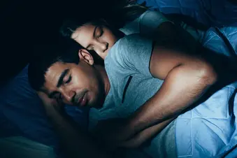 photo of couple sleeping at night