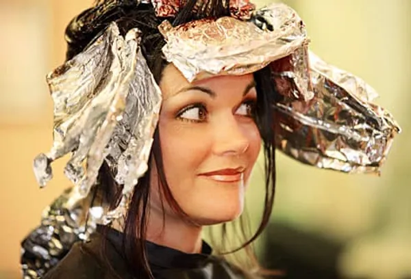 woman having hair dyed