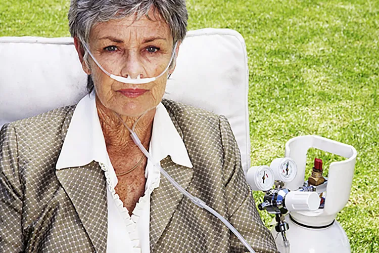 photo of mature woman using oxygen