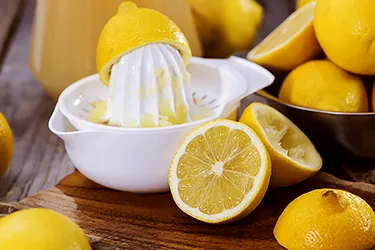 Love lemon water? Don't overdo it. Lemon juice's acidity can wear down tooth enamel. (Photo credit: JGI/Jamie Grill / Getty Images)