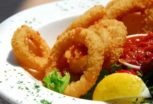 Bowl of fried calamari and sauce