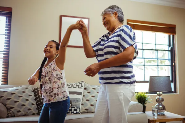 family dancing in living room