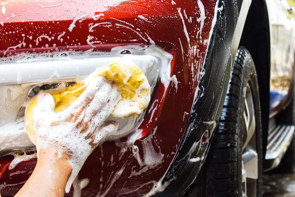 photo of hand washing car