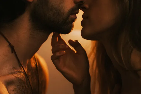 photo of couple leaning in for kiss